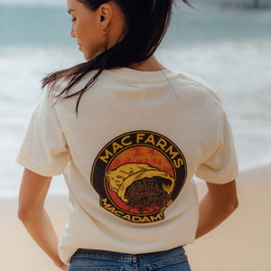 back of woman wearing vintage white t-shirt with burlap bag and macadamias design 