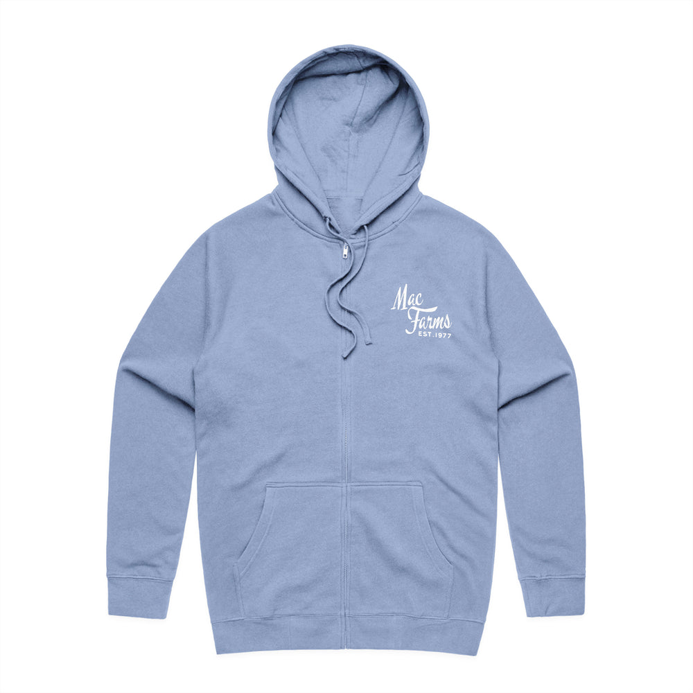 front of blue zip up with "Mac Farms Est. 1977" on pocket 