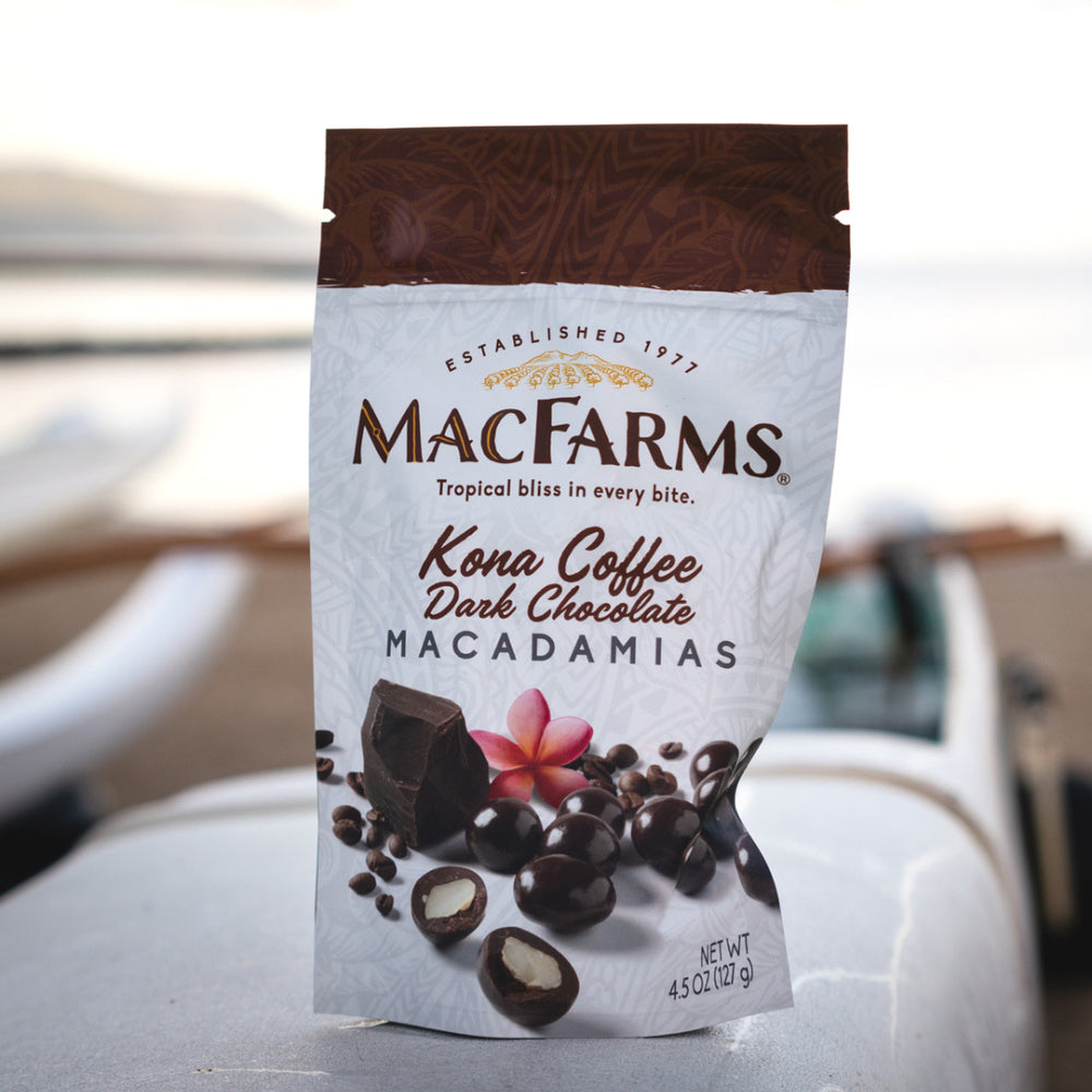 kona coffee dark chocolate macadamias on white surface